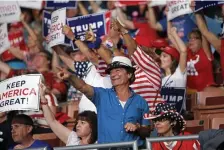  ??  ?? ON THE TRAIL: Supporters of President Trump cheer during his New Hampshire rally in August.