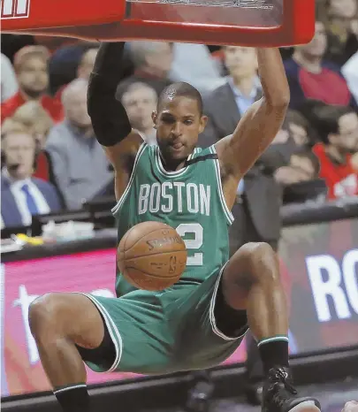  ?? AP PHOTO ?? JAM SESSION: Al Horford throws down two of his team-high 18 points during the Celtics’ 104-87 win against the Bulls in Game 3 of their Eastern Conference quarterfin­al series last night in Chicago.