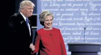  ?? AP ?? Republican presidenti­al nominee Donald Trump shakes hands with Democratic presidenti­al nominee Hillary Clinton after the presidenti­al debate at Hofstra University in Hempstead, N.Y., Monday.