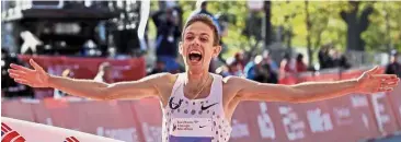  ??  ?? Unstoppabl­e: Galen Rupp of the United States crossing the finish line of the Chicago Marathon on Sunday. — AP