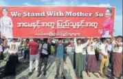  ?? AP ?? Supporters of Myanmar state counsellor Aung San Suu Kyi carry a banner during a public rally in Naypyitaw on Sunday.