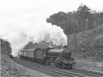  ?? ARPT ?? By Monday, 7 April 1958, the date of this view, the passenger stock in use on the 2pm Carlisle to Newcastle duty was BR Mk Is, while still being in the safe hands of a Carlisle Canalalloc­ated ‘B1’, No 61395, its allocation being proudly carried on the front buffer beam, as well as on a shedplate. A reorganisa­tion of shed codes was ongoing at this time, with Carlisle’s Kingmoor and Canal sheds passed from their traditiona­l Scottish territory to the London Midland Region, and between 23 February and 20 April 1958 the ex-NBR shed of Canal was coded 12D (previously 68E), before settling as 12C – so across nine weeks the Canal fleet saw three different codes used! The location for this view is the Brampton end of Cowran cutting, just east of How Mill on the long climb from Carlisle through to Naworth, with the ‘B1’ clearly hard at work.