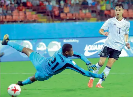  ??  ?? Germany’s Nicolas Kuhn scores against Guinea in their Fifa U- 17 World Cup Group C match at the Jawaharlal Nehru Stadium in Kochi on Friday. Germany won 3- 1. —