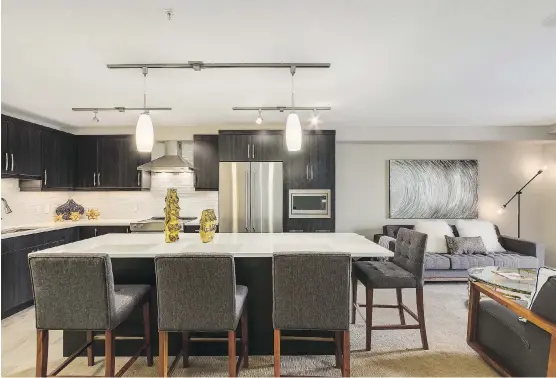  ?? COVE PROPERTIES ?? The interiors in the Apollo condominiu­ms are open concept and all of them have in-floor heating, quartz countertop­s and stainless steel appliances.