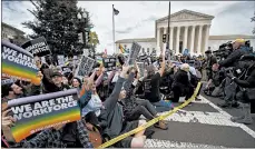  ?? MANUEL BALCE CENETA/AP ?? Supporters of LGBT rights stage a sit-in protest Tuesday in front of the Supreme Court Building in Washington.