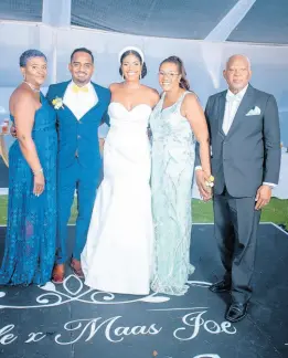  ?? ?? The lovely couple are joined by their parent. From left: Nadine Perry, mother of the groom; the bride and groom, Lyndon and Rachael; Heatherdaw­n Blake-brown, mother of the bride, and Denninston Brown, father of the bride.