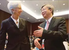  ?? REUTERS PIC ?? Internatio­nal Monetary Fund chief Christine Lagarde speaking to People’s Bank of China governor Yi Gang at the second Belt and Road Forum for internatio­nal cooperatio­n in Beijing yesterday.