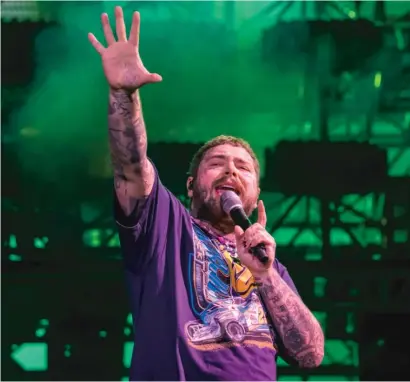  ??  ?? Going up against ’70s pop-rockers Journey on Saturday night, Post Malone was overwhelmi­ngly the choice of younger concert-goers.