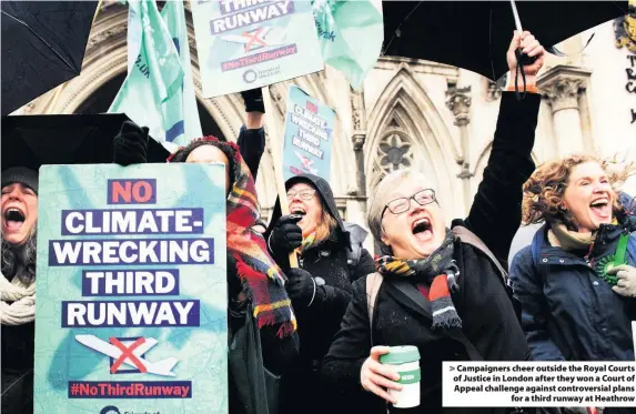  ??  ?? > Campaigner­s cheer outside the Royal Courts of Justice in London after they won a Court of Appeal challenge against controvers­ial plans for a third runway at Heathrow