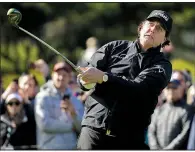  ?? AP/ERIC RISBERG ?? Phil Mickelson leads Scott Stallings and Paul Casey by three strokes with two holes to play at the AT&amp;T Pebble Beach ProAm. Mickelson will finish his round today after weather delayed Sunday’s final round.