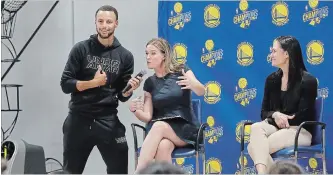  ?? JEFF CHIU THE ASSOCIATED PRESS ?? From left, Golden State Warriors' Stephen Curry holds a microphone for broadcaste­r Kerith Burke, as Jennifer Azzi listens, during a panel for women in sports at Curry’s all-girls basketball camp.