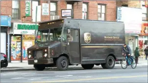  ?? EMON HASSAN/THE NEW YORK TIMES ?? A UPS truck makes deliveries in Manhattan, December 7.