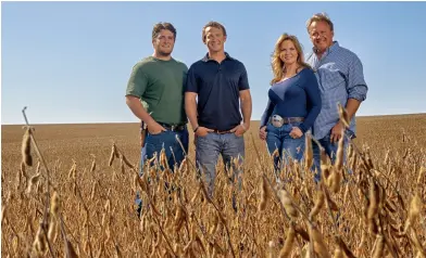  ??  ?? minnesota farmer mark gath, with his wife, leah, and sons, Stetson and Dalton, in one of their soybean fields. gath says if FBN doesn’t “get a Christmas card from monsanto, i like that.”