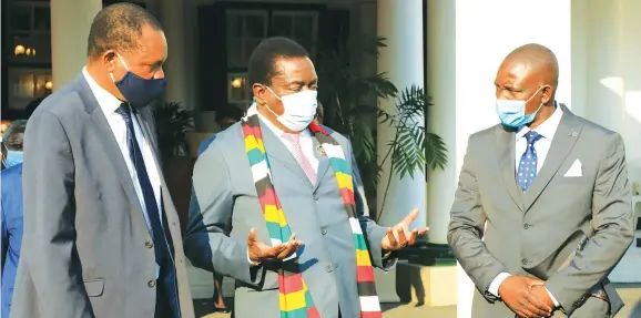  ?? — ?? President Mnangagwa speaks to the newly appointed Lands, Agricultur­e, Water and Rural Resettleme­nt Minister Dr Anxious Jongwe Masuka (left) and Energy and Power Developmen­t Minister Soda Zhemu after the swearing-in ceremony at State House in Harare on Monday. Picture: Tawanda Mudimu