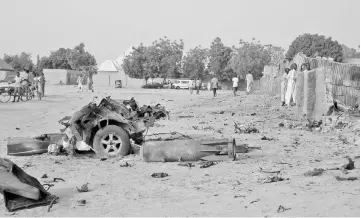  ?? — Reuters photo ?? Photo shows the damage at the site of an attack by Boko Haram militants in the northeast city of Maiduguri.