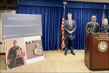  ?? Amy Davis / Tribune News Service ?? Erek L. Barron, U.S. attorney for Maryland, announces the arrests and a federal criminal complaint charging Sara Beth Clendaniel of Catonsvill­e, Md., and Brandon Clint Russell of Orlando, Fla., with conspiracy to destroy an energy facility. At left is Special Agent in Charge Thomas J. Sobocinski, and at right is Assistant U.S. attorney Kathleen O. Gavin.