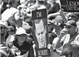  ??  ?? Fans hold up a placard of Australian batsman Steve Smith on the first day of the second test against New Zealand at the Melbourne Cricket Ground in Melbourne yesterday. — AFP