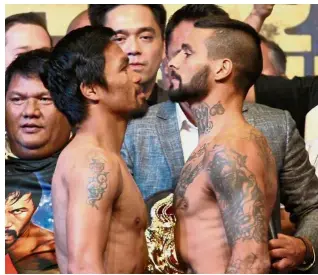  ??  ?? Looking lean and mean: Manny Pacquiao (left) and Lucas Matthysse facing off during the weigh-in at the Malaysia Internatio­nal Trade and Exhibition Centre yesterday. — S.S. KANESAN/ The Star