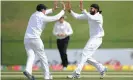  ?? Photograph: Gareth Copley/ Getty Images ?? Monty Panesar celebrates with Graeme Swann after taking one of his 167 Test wickets for England.