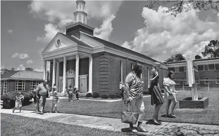  ?? Michael S. Williamson / Washington Post ?? Congregant­s leave the First Baptist Church in Luverne, Ala., after a Sunday morning service.