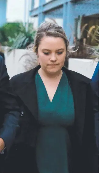 ?? Picture: DAVID CLARK ?? Amy Crisp leaves Southport Coroner’s Court yesterday after giving evidence into the Thunder River Rapids Ride at Dreamworld.