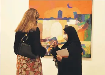  ?? Vidhyaa Chandramoh­an for The National ?? Visitors connect with artworks again at this year’s Abu Dhabi Art