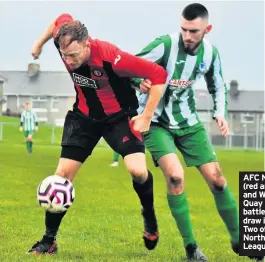  ??  ?? AFC Newbiggin (red and black) and Willington Quay Saints battle out a 1-1 draw in Division Two of the Northern Alliance League