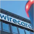  ?? FOTO: PETER KNEFFEL/DPA ?? Das Wirecard-Logo im Sommer 2020 am einstigen Hauptsitz des Zahlungsdi­enstleiste­rs.