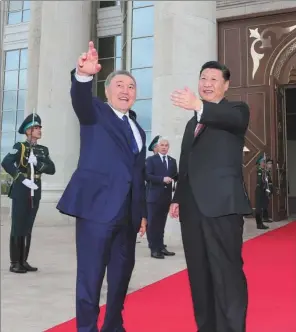  ?? LAN HONGGUANG / XINHUA ?? President Xi Jinping speaks with Kazakhstan’s President Nursultan Nazarbayev in the capital, Astana, after his arrival on Wednesday for a four-day visit.