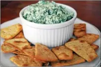  ?? PHOTO BY EMILY RYAN ?? Artichoke hearts and spinach star in this deliciousl­y simple dip.