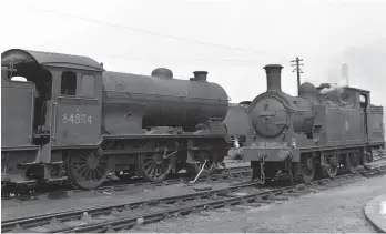  ?? W A C Smith/Transport Treasury ?? W A C (Bill) Smith was among those that visited Carlisle Canal shed on Sunday, 15 June 1958 and took several photograph­s, the archived report for the day stating that 44 locomotive­s were noted and that they collective­ly represente­d 13 classes. This view, taken on that day near the turntable, records two of Canal shed’s stalwarts, Reid ‘N15’ 0-6-2T No 69215 and Gresley ‘J39’ 0-6-0 No 64884, with between them over 23 years thus far served from this shed, but there were also 11 visitors on hand, from four sheds – St Margarets (two ‘B1s’, two ‘K3s’ and three ‘V2s’), Haymarket (one ‘A3’), Gateshead (one ‘B1’), and Blaydon (one ‘K3’). For the record, the latest shake-up of local shedcodes, concluded on 20 April 1958 and with 12C thereafter given to Canal, is being carried by No 69215.