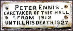  ??  ?? ABOVE: The plaque to Peter, placed in Liberty Hall in 1927. It remained there until the Hall was demolished in 1958. The writer’s father had mentioned a plaque to him as a teenager, but it wasn’t until 2017 that it was discovered by Ed Penrose at the Irish Labour History Society Museum. LEFT: Paul Ennis, left, and his brother Micheál at Peter Ennis’s grave in Killaveny Graveyard.