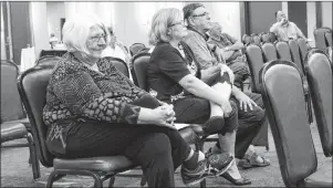  ?? ERIN POTTIE/CAPE BRETON POST ?? Helen Doherty, left, listens to the proceeding­s at a Utility and Review Board hearing Friday in relation to the developmen­t of a RV park and campground in her home community of Big Pond. Doherty testified Friday that the developmen­t will interrupt the serenity of her rural neighbourh­ood.