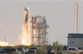  ?? Tony Gutierrez / Associated Press ?? A Blue Origin rocket launches July 20 from its spaceport in Texas, carrying Jeff Bezos, his brother Mark Bezos, Oliver Daemen and Wally Funk.