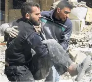  ??  ?? The photo released by the Syrian Civil Defense White Helmets, which has been authentica­ted based on its contents and other AP reporting, shows members of the White Helmets carrying a man who was wounded after airstrikes and shelling hit in Arbeen, in...