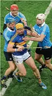  ??  ?? CROWDED OUT: Three Dubs take on Tipp’s Padraic Maher