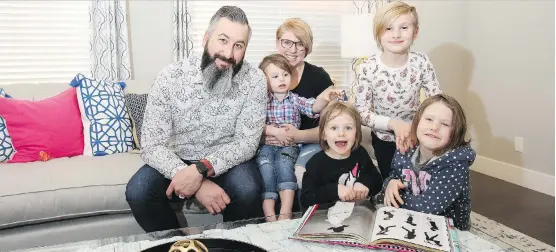  ?? WIL ANDRUSCHAK ?? Don and Megan Kliparchuk and their children, Dublin, three, Salem, four, Payton, eight, and Bella, six, enjoy their Sterling Homes McKinley model in Harmony.