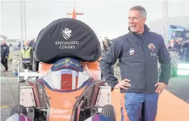  ??  ?? > Pilot Andy Green stands beside the Bloodhound