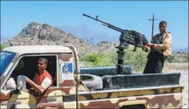  ?? Ahmad al-Basha AFP/Getty Images ?? A FIGHTER mans a machine gun near Taez, Yemen. The growing violence and a government blockade of fuel ships have exacerbate­d the humanitari­an crisis.