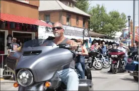  ?? STEPHEN GROVES / AP ?? Motorcycle­s fill the streets of Sturgis, S.D., on Friday as the Sturgis Motorcycle Rally began. The annual rally returns just as coronaviru­s cases in the state are rising with the more contagious delta variant.