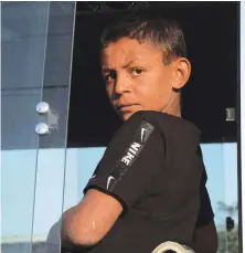  ?? AFP ?? civilians and more have been displaced due to Turkey’s weekold offensive, the Britain-based Syrian Observator­y said. A child stares from a minibus transporti­ng Syrians at the Bardarash camp, near the Kurdish city of Dohuk, in Iraq’s autonomous Kurdish region.