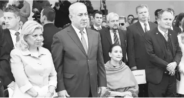  ?? — AFP photo ?? Netanyahu (second left), his wife Sara (left) and Argentina’s Vice-President Gabriela Michetti (second right) paying homage to the 29 people killed a in a terrorist bombing attack to the Israeli embassy in 1992, at the embassy in Buenos Aires.