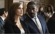  ?? MICHAEL GIBSON, STX ENTERTAINM­ENT ?? Jessica Chastain and Idris Elba in "Molly’s Game."