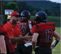  ?? The Sentinel-Record/James Leigh ?? Cutter Morning Star head coach Matt Kinsinger talks to Drake Bissell during a Sept. 3 game at Eagle Field. The Eagles travel to Rison Friday to face Woodlawn.