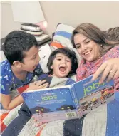  ??  ?? BEDTIME READING: Amirah with her two sons.