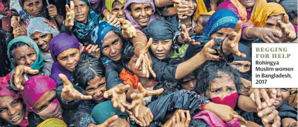  ??  ?? BEGGING FOR HELP Rohingya Muslim women in Bangladesh, 2017