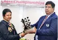  ??  ?? Women's champ Nethmi, receiving her award from Luxman Wijesuriya, the Chess Federation President