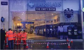  ??  ?? Greenpeace staged an anti-tar sands pipelines protest at Barclays Bank in Piccadilly Circus today. Photograph: Jiri Rezac/Greenpeace