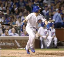  ??  ?? Chicago Cubs' Ian Happ watches his first home run at Wrigley Field off Cincinnati Reds starting pitcher Bronson Arroyo during the fifth inning of a baseball game Tuesday in Chicago. (AP)