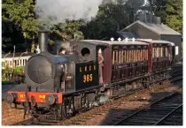  ?? LAWRIE ROSE ?? LNER ‘Y7’ 0-4-0T No. 985 passes the Mid-Suffolk Light Railway’s new engine shed with a two-coach train to Brockford.